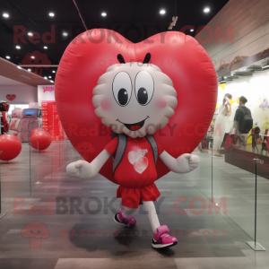 nan Heart Shaped Balloons mascot costume character dressed with a Running Shorts and Backpacks