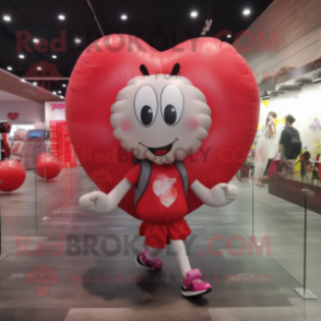 nan Heart Shaped Balloons mascot costume character dressed with a Running Shorts and Backpacks