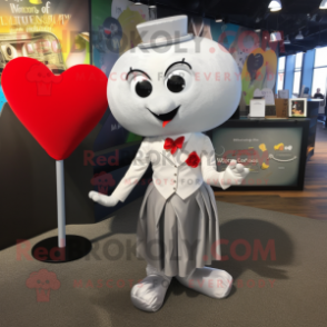 Silver Heart mascot costume character dressed with a Pencil Skirt and Pocket squares