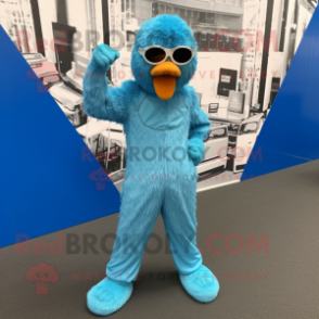 Cyan Ostrich mascot costume character dressed with a Jumpsuit and Cufflinks