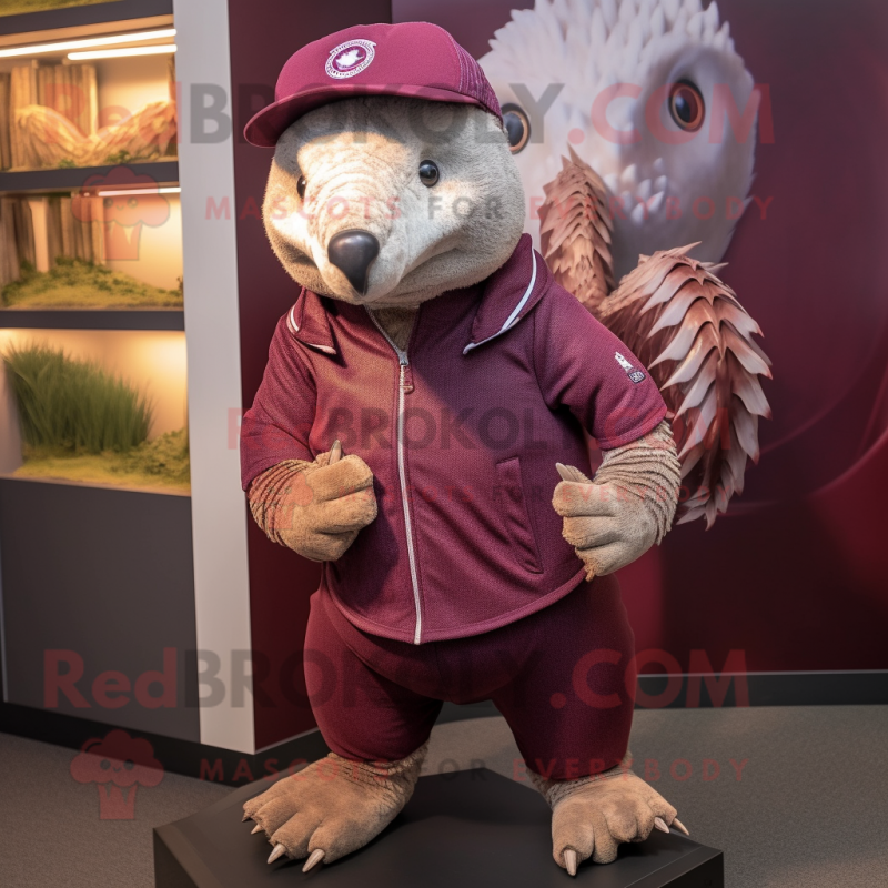 Maroon Pangolin mascot costume character dressed with a Henley Shirt and Hats Maroon Pangolin mascot costume character dressed with a Henley Shirt and Hats