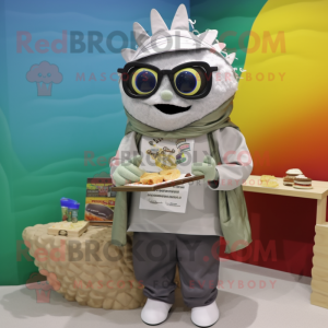 Silver Fish Tacos mascot costume character dressed with a Parka and Reading glasses