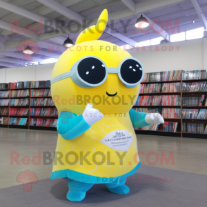 Yellow Narwhal mascot costume character dressed with a Romper and Reading glasses