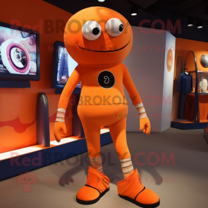 Orange Cyclops mascot costume character dressed with a Jeggings and Belts