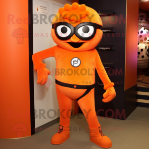 Orange Cyclops mascot costume character dressed with a Jeggings and Belts