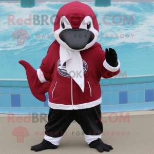 Maroon Killer Whale mascot costume character dressed with a Bermuda Shorts and Scarf clips