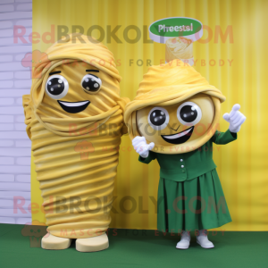 Gold Pesto Pasta mascot costume character dressed with a Wrap Skirt and Lapel pins