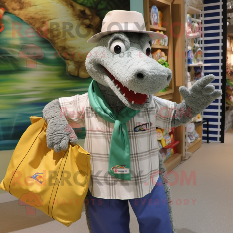 Silver Crocodile mascot costume character dressed with a Button-Up Shirt and Tote bags