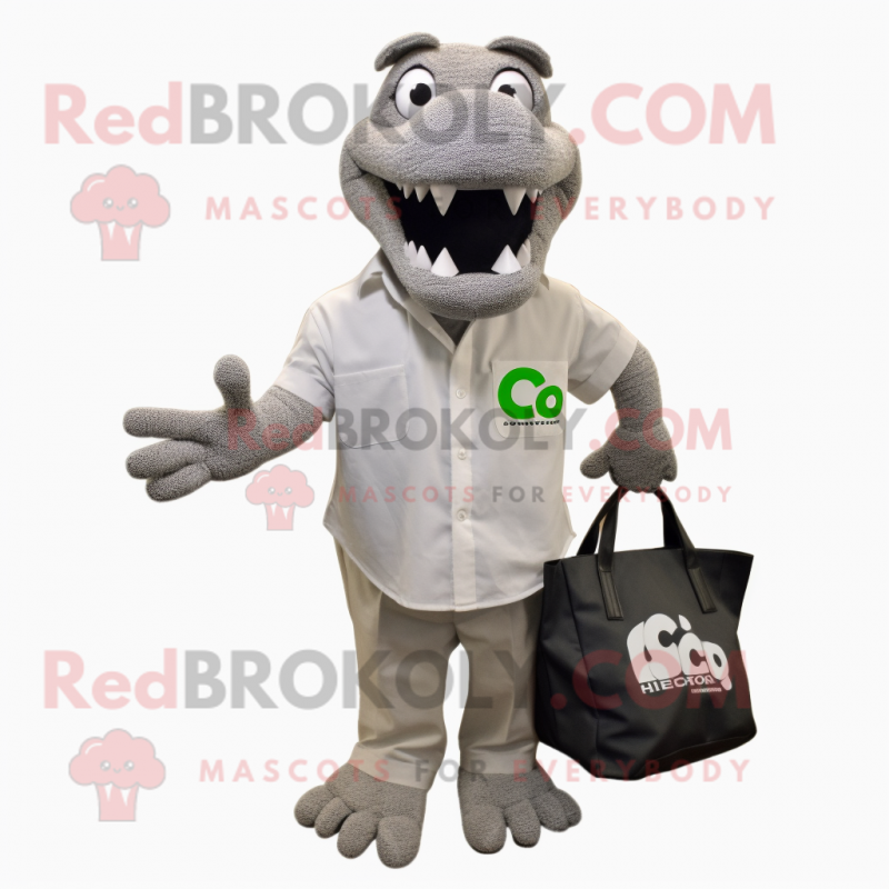 Silver Crocodile mascot costume character dressed with a Button-Up Shirt and Tote bags