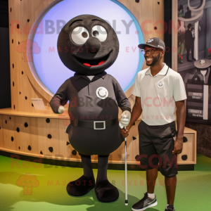 Black Golf Ball mascot costume character dressed with a Henley Shirt and Watches