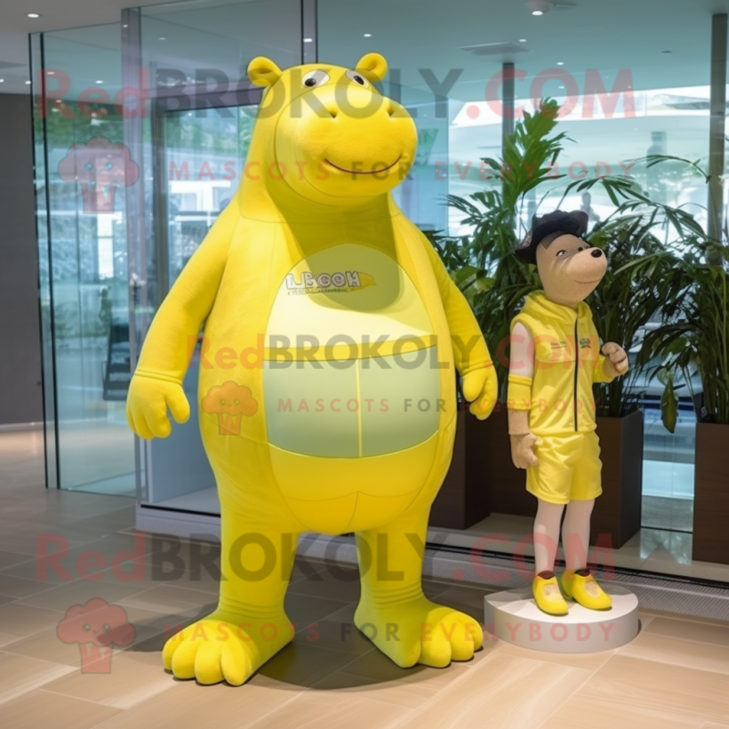 Lemon Yellow Hippopotamus mascot costume character dressed with a Bikini and Watches Lemon Yellow Hippopotamus mascot costume character dressed with a Bikini and Watches