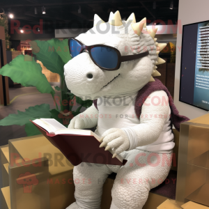 White Ankylosaurus mascot costume character dressed with a Long Sleeve Tee and Reading glasses