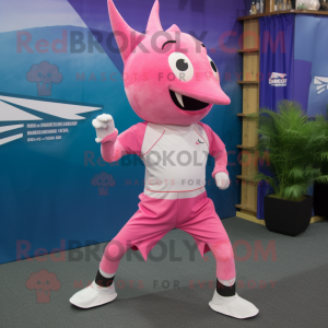 Pink Swordfish mascot costume character dressed with a Running Shorts and Headbands