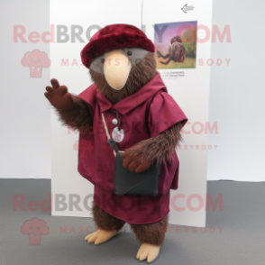 Maroon Kiwi mascot costume character dressed with a Overalls and Shawl pins