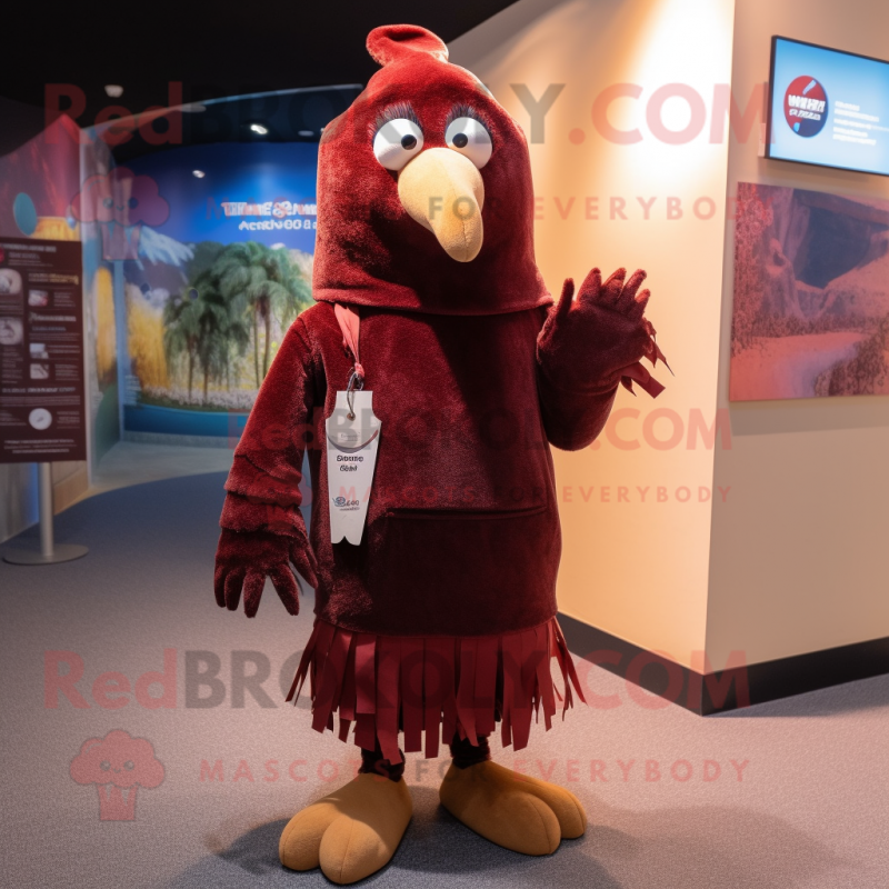 Maroon Kiwi mascot costume character dressed with a Overalls and Shawl pins