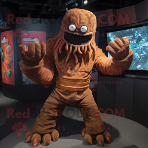 Brown Kraken mascot costume character dressed with a T-Shirt and Gloves