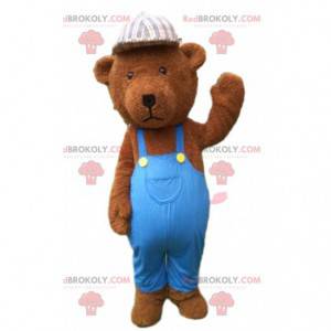 Mascotte de nounours marron habillé en bleu, ours en peluche -