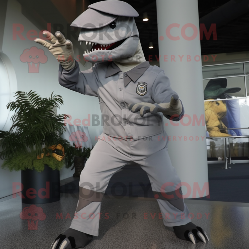 Gray Tyrannosaurus mascot costume character dressed with a Capri Pants and Berets