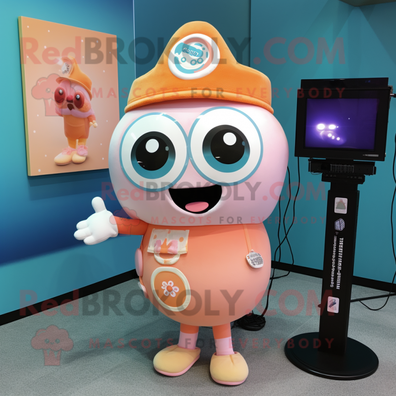 Peach Camera mascot costume character dressed with a Graphic Tee and Lapel pins Peach Camera mascot costume character dressed with a Graphic Tee and Lapel pins