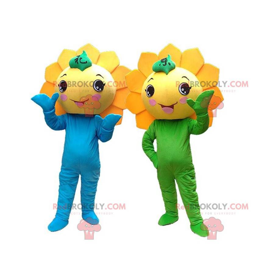 2 maskoter med gule blomster, kostymer av gigantiske solsikker