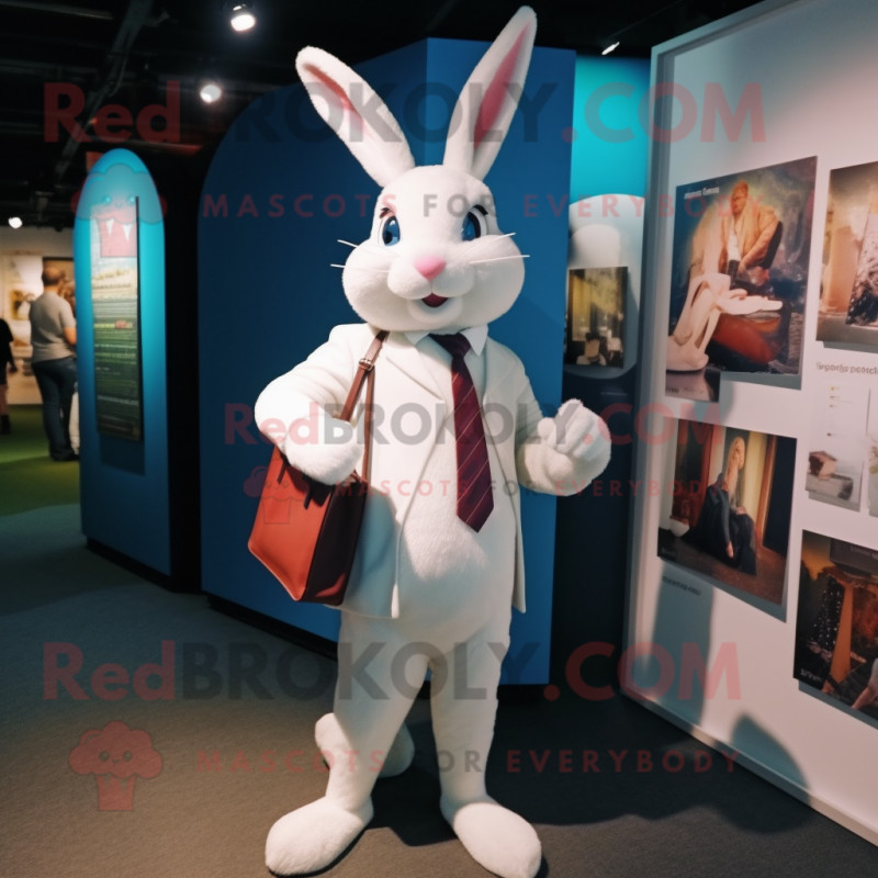 White Rabbit mascot costume character dressed with a Blazer and Messenger bags