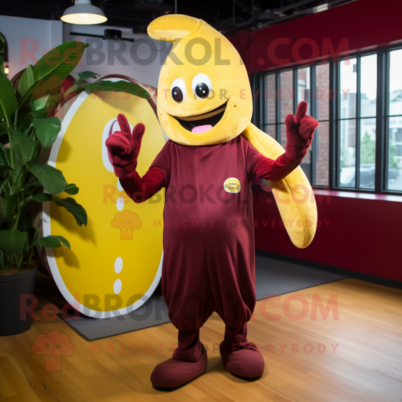 Maroon Banana mascot costume character dressed with a Playsuit and Beanies Maroon Banana mascot costume character dressed with a Playsuit and Beanies
