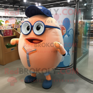 Peach Human Cannon Ball mascot costume character dressed with a Denim Shorts and Reading glasses