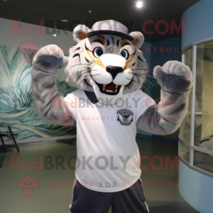 Silver Saber-Toothed Tiger mascot costume character dressed with a Rash Guard and Hats