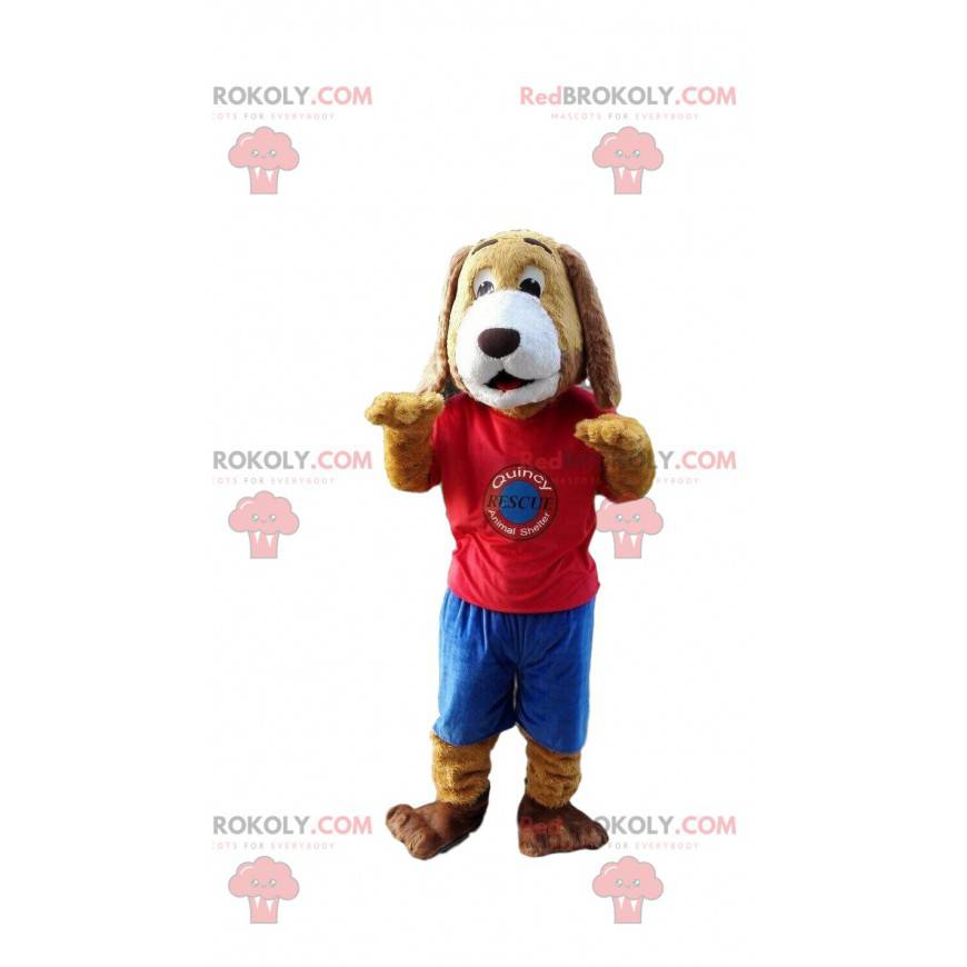 Mascote cachorro marrom e branco com roupas esportivas -