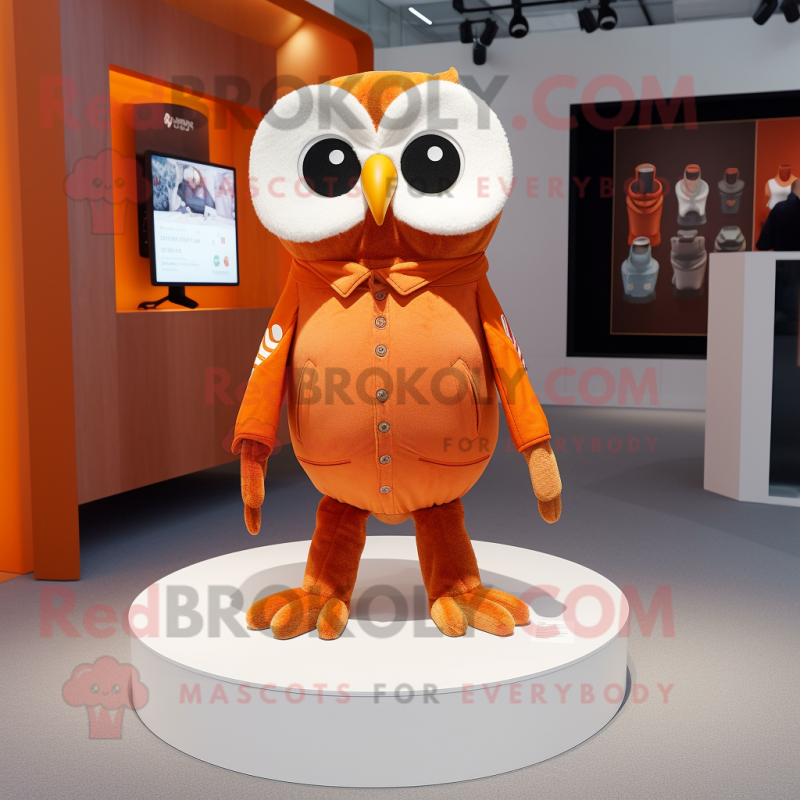 Orange Owl mascot costume character dressed with a Bootcut Jeans and Cufflinks