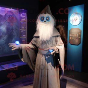 Silver Wizard mascot costume character dressed with a Henley Shirt and Brooches