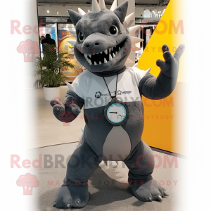 Gray Stegosaurus mascot costume character dressed with a Flare Jeans and Smartwatches