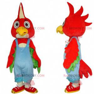 Maskot červený pták s modrým overalem, barevný kostým -