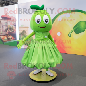 Lime Green Mango mascot costume character dressed with a Skirt and Shoe clips