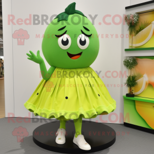 Lime Green Mango mascot costume character dressed with a Skirt and Shoe clips