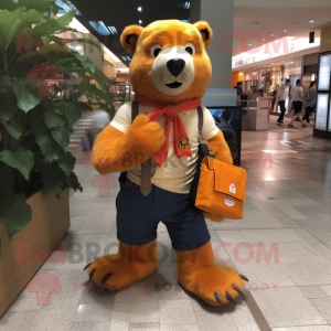Orange Sloth Bear mascot costume character dressed with a Oxford Shirt and Messenger bags