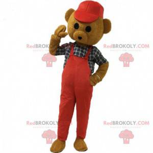 Mascota del oso de peluche marrón vestida de rojo con una gorra