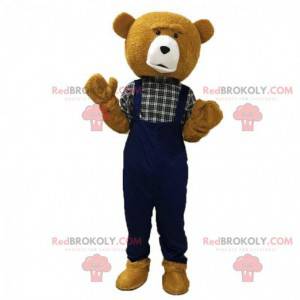 Mascote urso de pelúcia marrom, vestido de macacão -