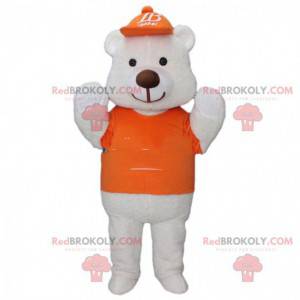 Stor hvid bjørnemaskot klædt i orange med en kasket -