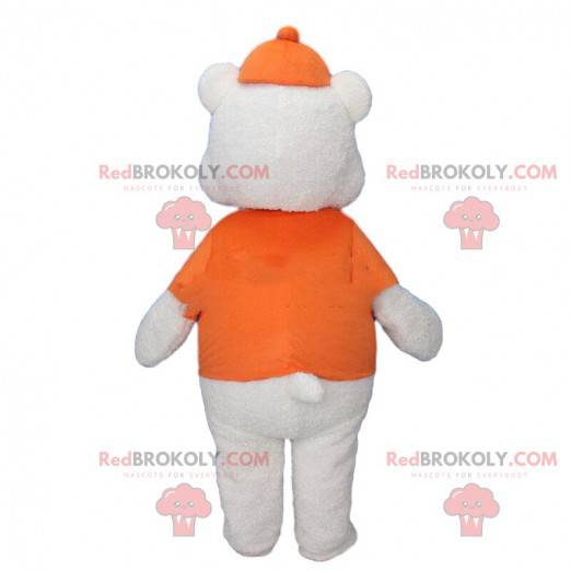 Stor hvid bjørnemaskot klædt i orange med en kasket -