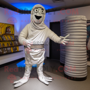 Silver Mummy mascot costume character dressed with a Capri Pants and Mittens