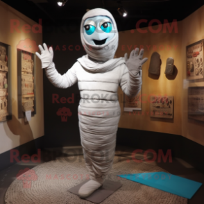 Silver Mummy mascot costume character dressed with a Capri Pants and Mittens