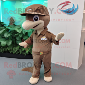 Brown Dolphin mascot costume character dressed with a Dress Pants and Brooches