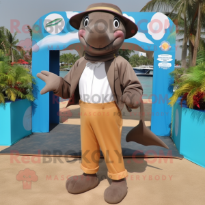 Brown Dolphin mascot costume character dressed with a Dress Pants and Brooches