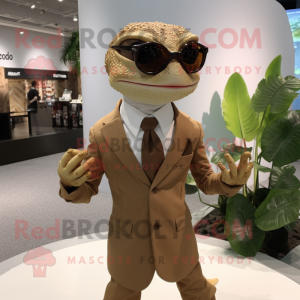 Tan Geckos mascot costume character dressed with a Suit and Eyeglasses