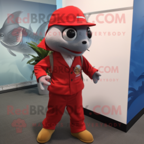 Red Tuna mascot costume character dressed with a Suit Pants and Caps