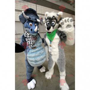2 mascotte: un cane grigio e bianco e un dinosauro blu -
