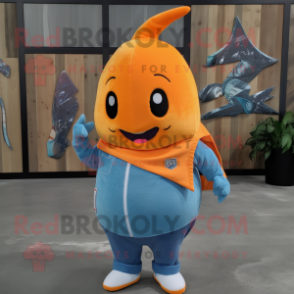 Orange Narwhal mascot costume character dressed with a Denim Shirt and Shoe clips