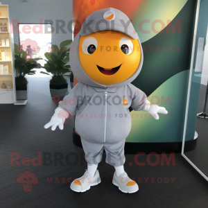 Gray Grapefruit mascot costume character dressed with a Polo Shirt and Shoe clips