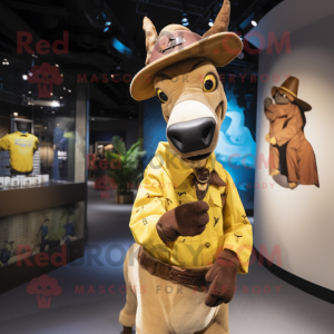 Yellow Okapi mascot costume character dressed with a Denim Shorts and Hat pins